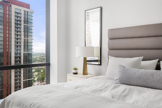 Primary suite is tucked away from the entertainment space in the rear wing of the property. Featuring a very spacious walk-in closet. | Image 20