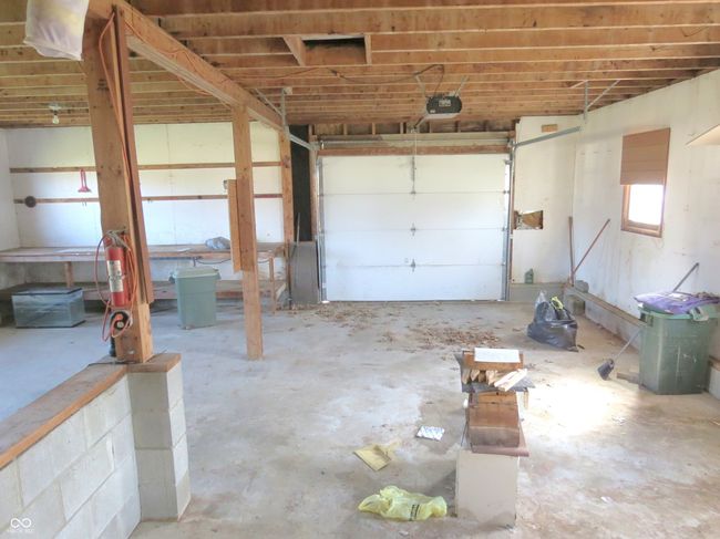 garage with a garage door opener | Image 12