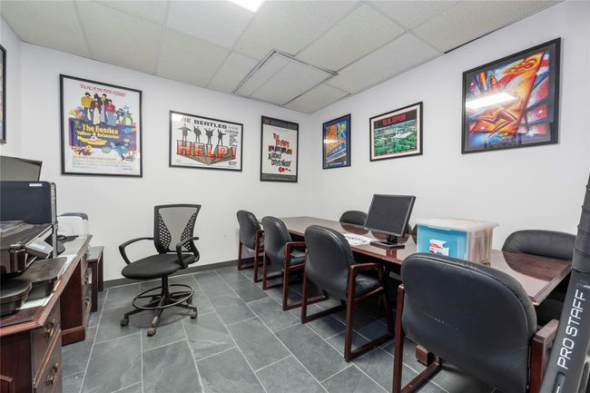 Office with a paneled ceiling and tile patterned floors | Image 40