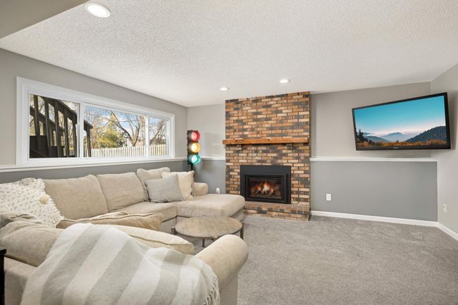 downstairs living room with 2022 installed fireplace insert | Image 19