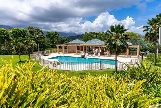 Poha Kea Point grounds are lush, colorful and well maintained. The pool and rec center are mostly surrounded by greenery, for privacy while owners enjoy these amenities. | Image 24