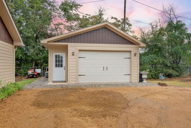 Style is evident even in the garage. Notice the set back door and how the building matches the home. | Image 29