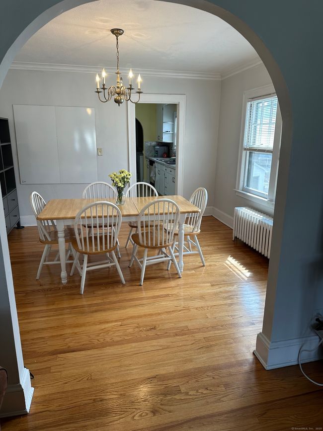 Beautiful archway from the living room into the large dining room area | Image 7