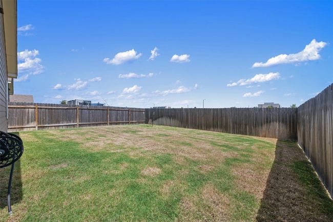 View of fenced backyard | Image 35
