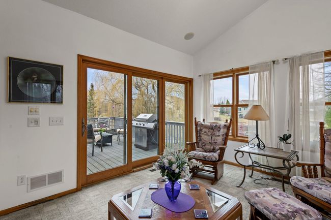 Sunroom walks out to deck | Image 8