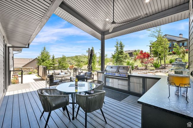 Deck featuring outdoor dining area, an outdoor living space, and a ceiling fan | Image 59