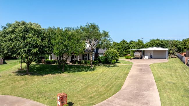 View of front of property featuring concrete driveway and a carport | Image 5