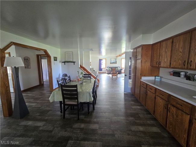 Kitchen with brown cabinetry and light countertops | Image 5
