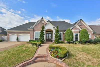 This home has stunning curb appeal with extensive landscaping. | Image 3