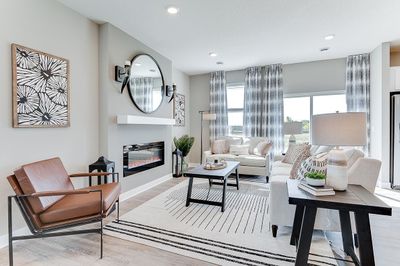 Cozy up with friends or family in front of the fireplace and watch a movie...or just chill and read a book! *Pictures of model home, colors may vary. | Image 3