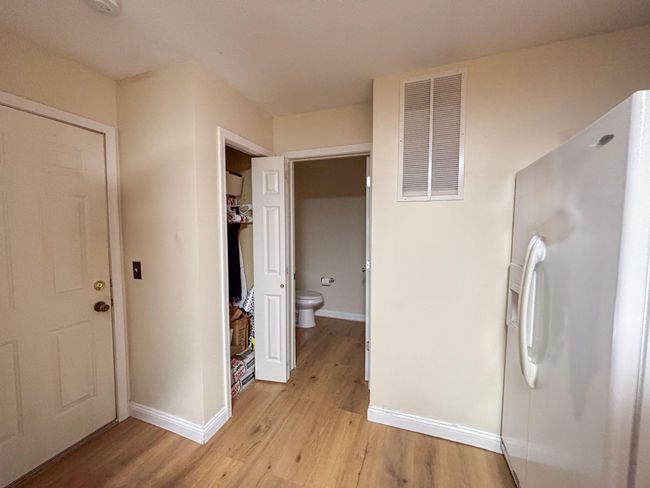 View to Garage entrance and half bath | Image 6