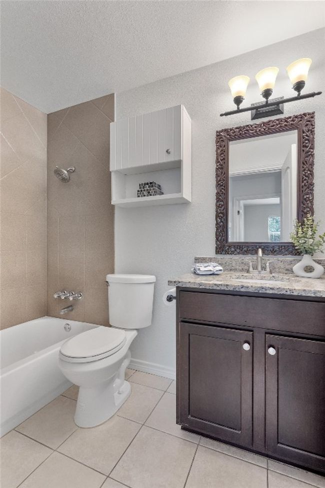 The bathroom also features a bathtub, making it the perfect place to unwind after a long day. | Image 21