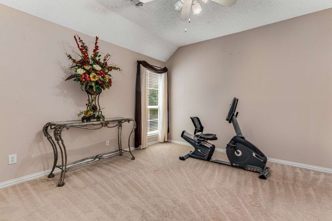 Bedroom 3 with ceiling fan, carpet floors, vaulted ceiling, and baseboards | Image 31