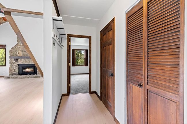 Hallway to 2 lower level bedrooms and laundry | Image 29