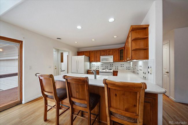 Kitchen with Corian Countertops, Peninsula Seating | Image 16