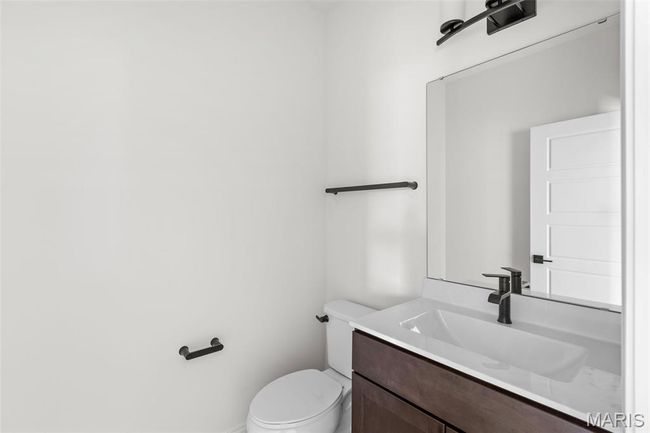 Half bathroom with vanity and toilet | Image 22