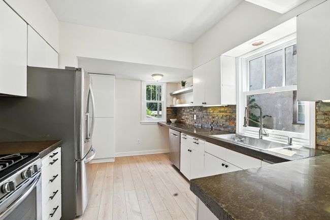 Kitchen with new floor | Image 11