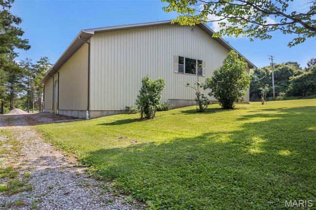 View of home's exterior with a yard and driveway | Image 19