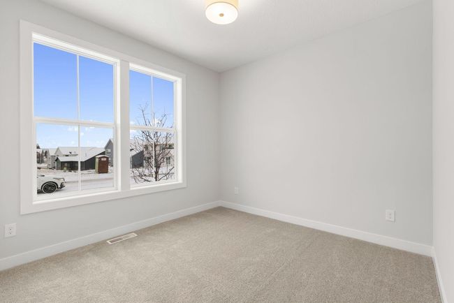 The spacious secondary bedroom #2 offers plenty of natural light, a large closet, and ample room for customization, making it perfect for guests, children, or a home office. | Image 28