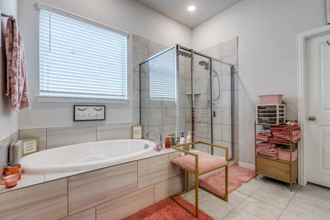 Full bathroom featuring a shower stall, a garden tub, and tile patterned flooring | Image 14