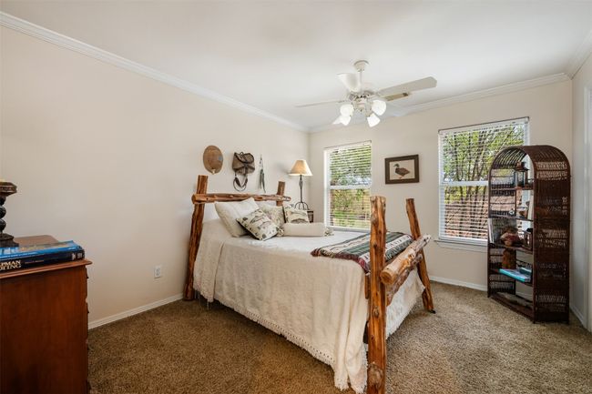 Upstairs, this is the first of the secondary bedrooms. | Image 25