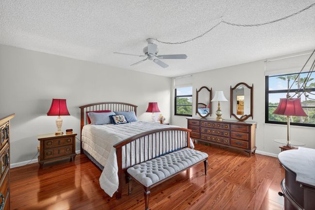 Huge Primary Suite with Sitting Area, Large Walk in Closet, Great Views of the Pool, Lake, And Garden from both Windows and the Sliding Glass Doors | Image 20