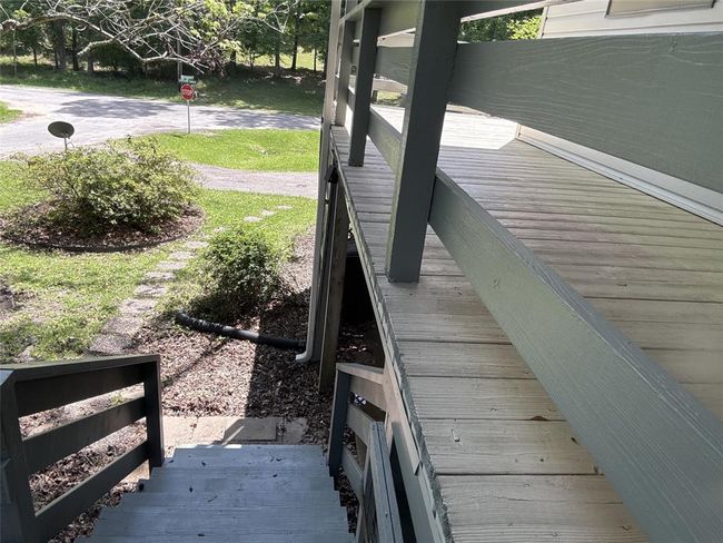 Charming stepping stones guide you to the inviting lower deck stairs. | Image 22