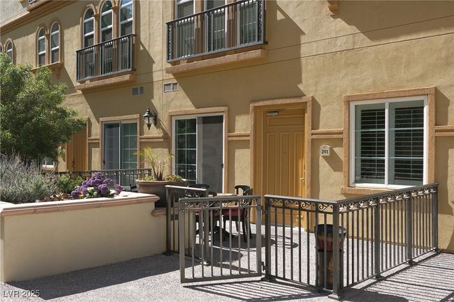 Entrance to property featuring stucco siding | Image 14