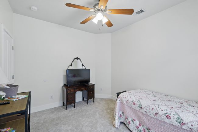 Carpeted bedroom featuring baseboards and ceiling fan | Image 29