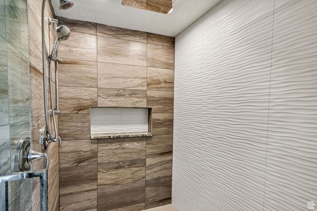 Bathroom with a tile shower | Image 42