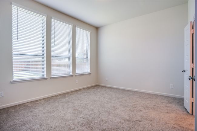 Spare room featuring plenty of natural light, carpet floors, and baseboards | Image 14