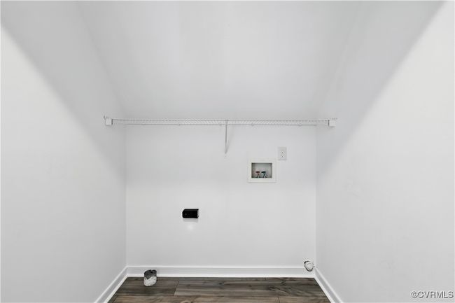 Laundry area featuring electric dryer hookup, hookup for a washing machine. | Image 26