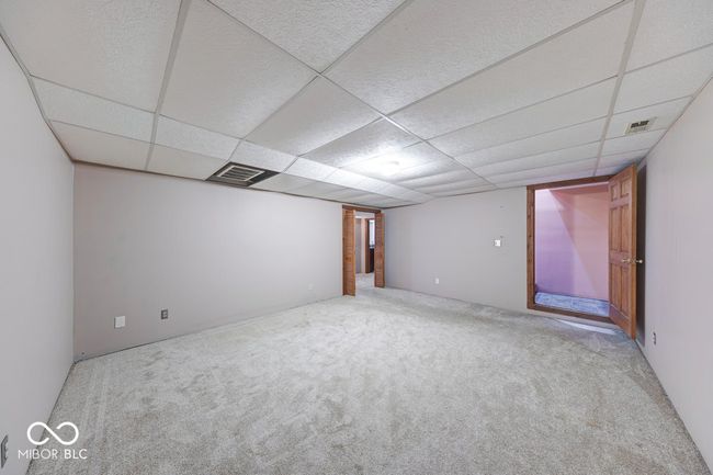 empty room with carpet floors and a paneled ceiling | Image 25