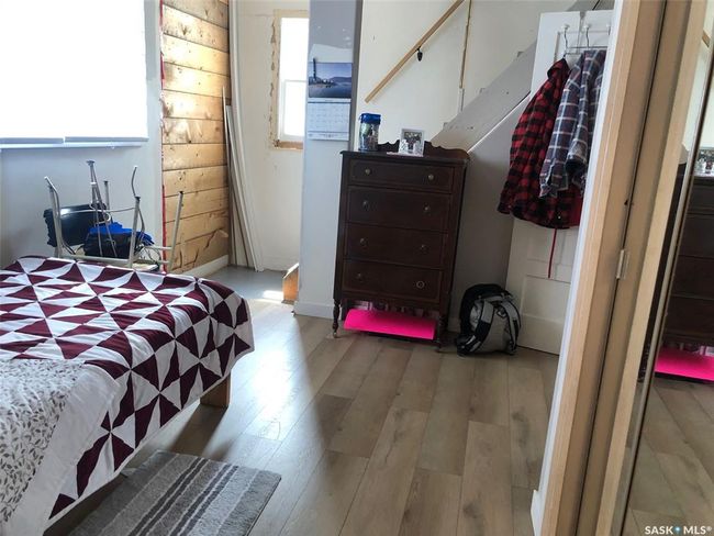 Bedroom featuring wood finished floors | Image 35