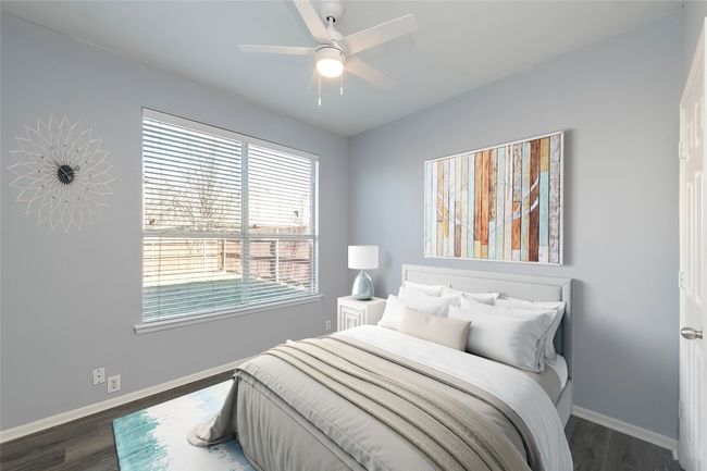 Bedroom featuring dark wood-style floors, baseboards, and a ceiling fan | Image 10