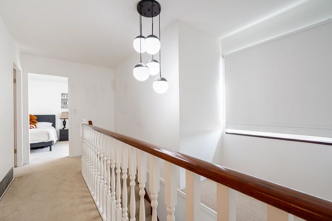 Corridor with light carpet and an upstairs landing | Image 29