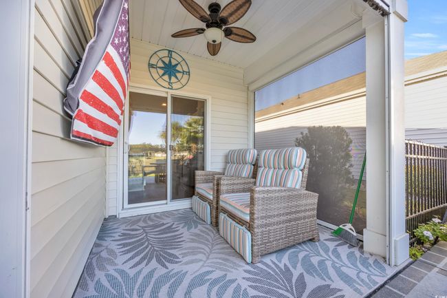 Sunroom / solarium featuring a ceiling fan | Image 27