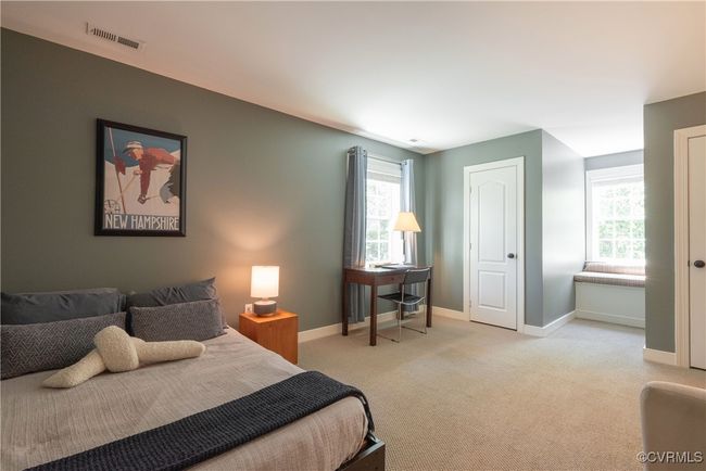 Bedroom featuring visible vents, baseboards, and light colored carpet | Image 24