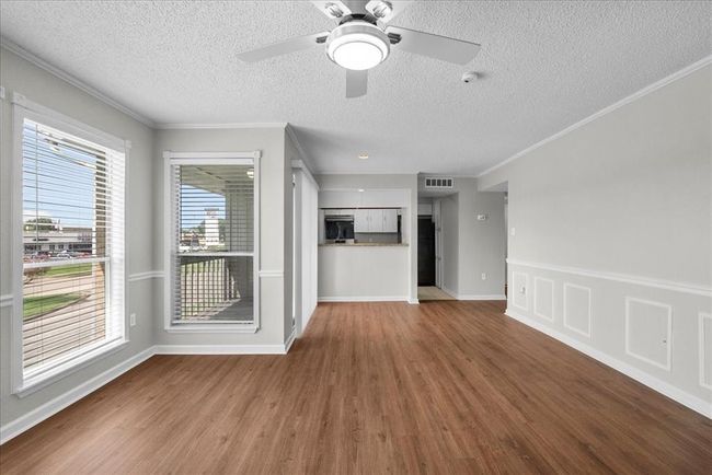 From kitchen convos to balcony sunsets, this family room is made for living well. | Image 8