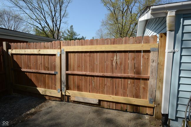 view of gate featuring fence | Image 45