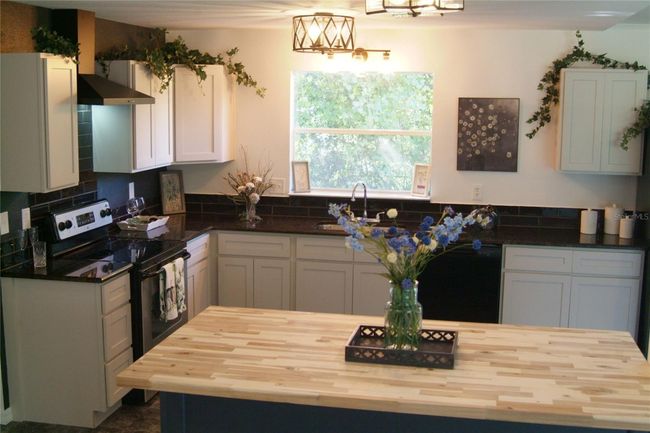 Custom Wood Butcher Block Countertop on Custom Trimmed Island with Barstool Seating | Image 5