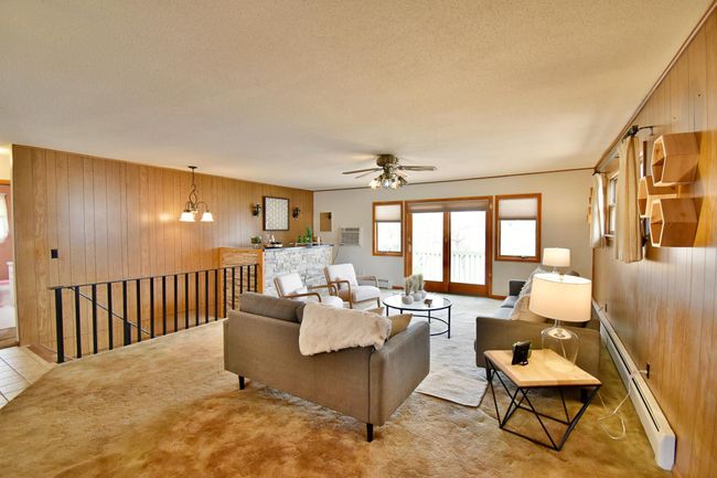 Family room with lake view and bar | Image 13