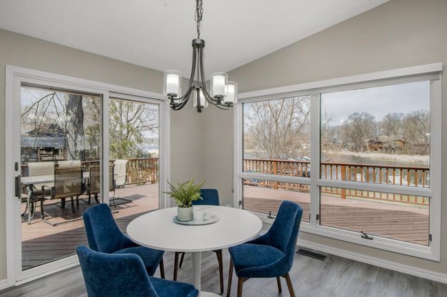 Dining table looks out to lake | Image 10