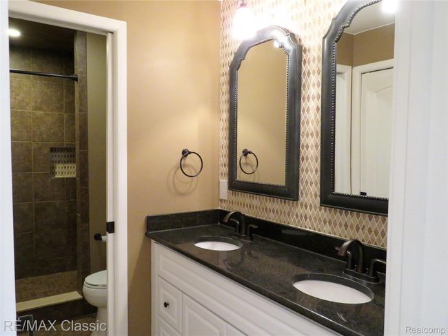 Elegant bath with double vanities and designer tile work! | Image 18