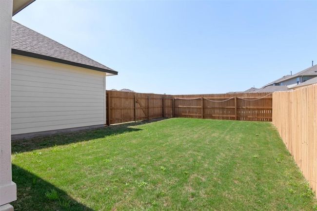 View of yard featuring a fenced backyard | Image 30
