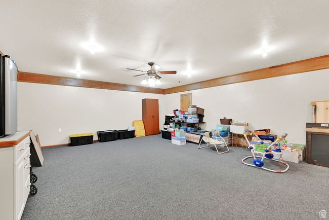 Rec room featuring carpet floors and ceiling fan | Image 56