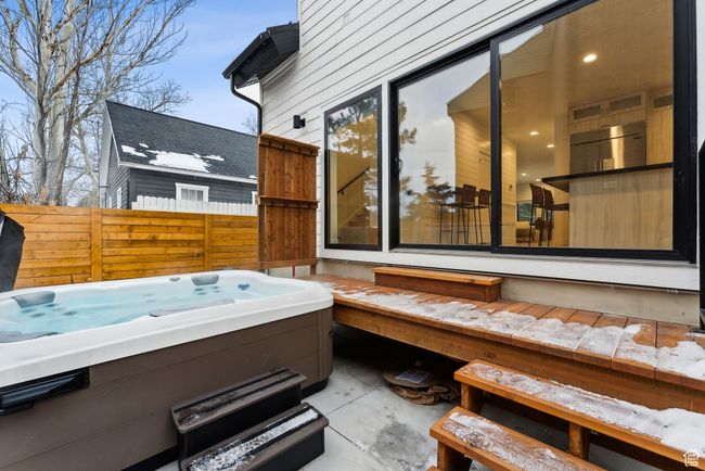 View of patio featuring a hot tub | Image 12