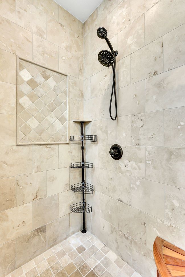 The tiled shower is light and beautiful. | Image 34