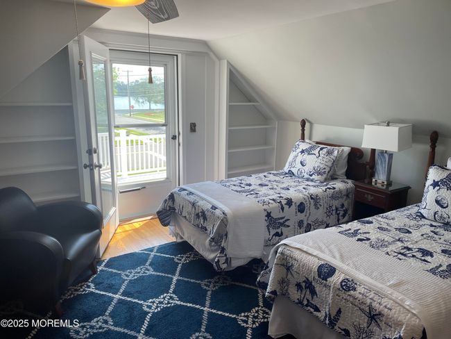 2 nd floor bedroom with large sun deck with views of Wreck Pond | Image 27