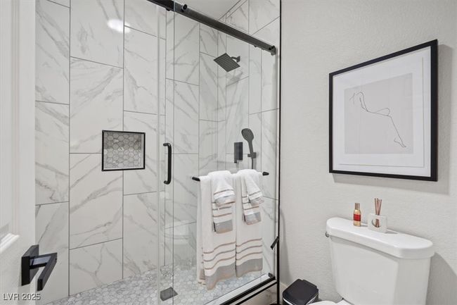 The redesigned master retreat offers a spa-inspired bathroom with dual sinks, a walk-in shower, & beautiful finishes. STUNNING! | Image 25
